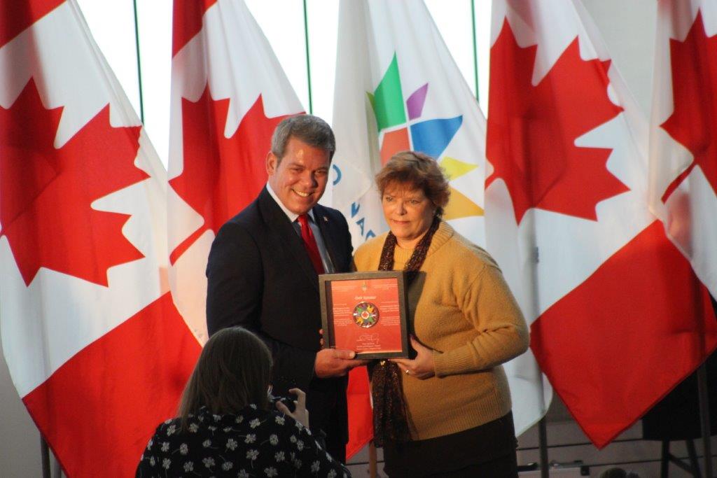 Vance Badawey, MP Niagara Centre presenting Debi Katsmar Canada 150 Award
