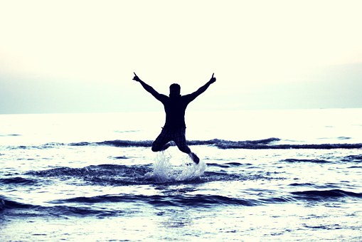 jumping for joy in the water