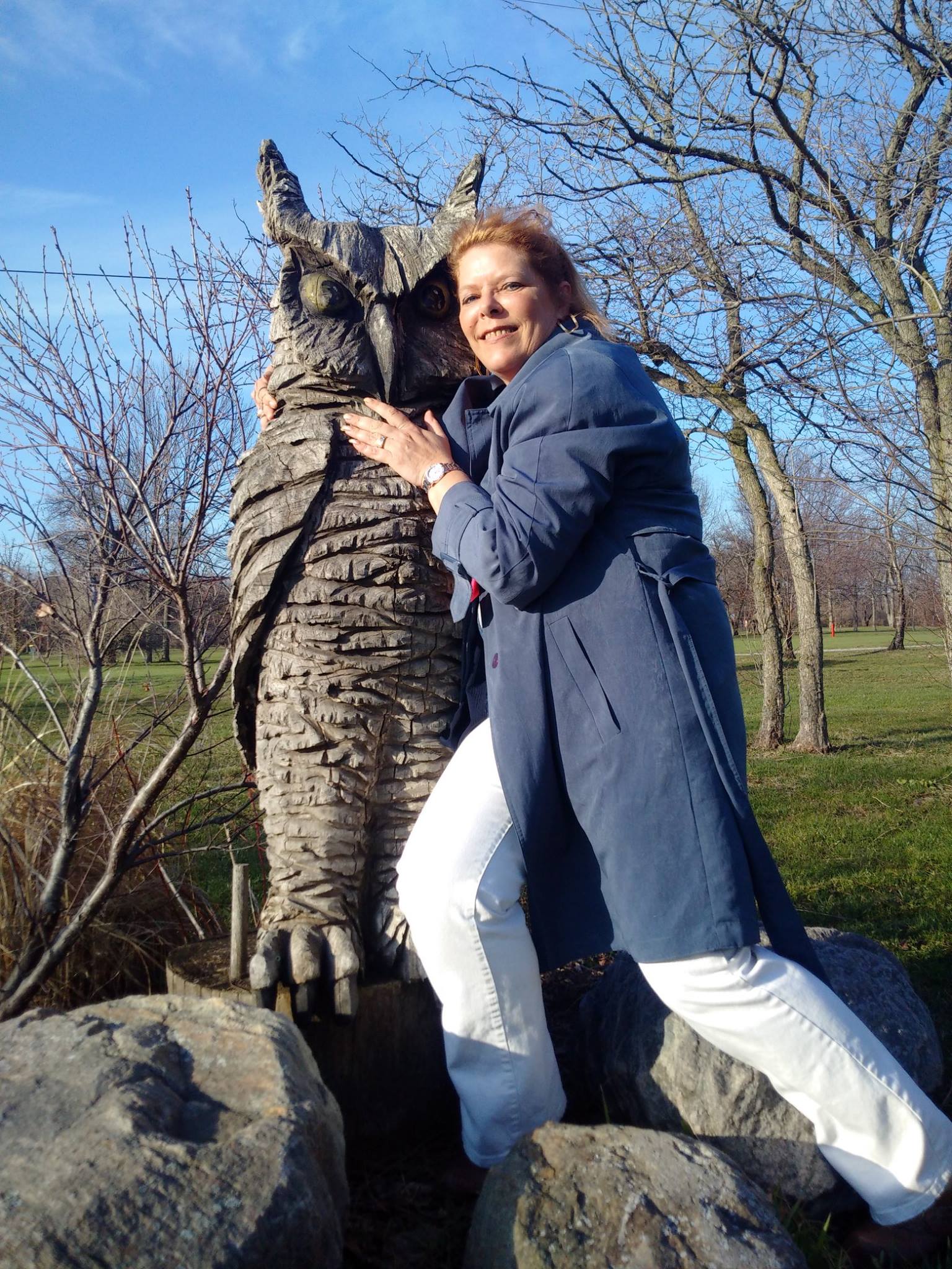 Debi Katsmar hugging an owl